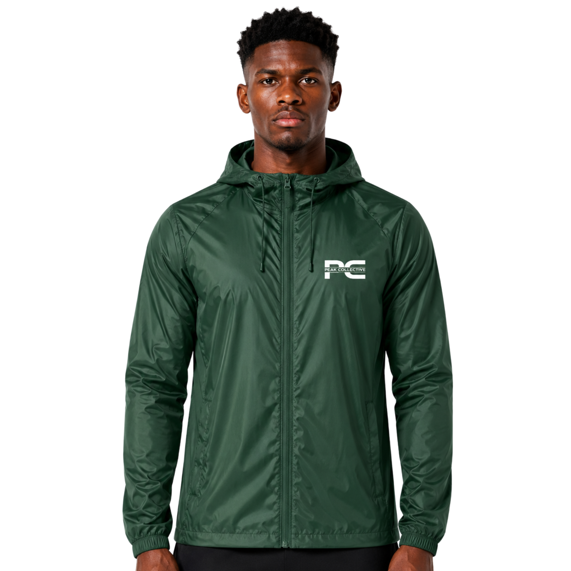 Model wearing green AerisShell lightweight performance windbreaker jacket with visible brand logo on grey background – breathable activewear layer for running, outdoor training, workouts, and everyday movement
