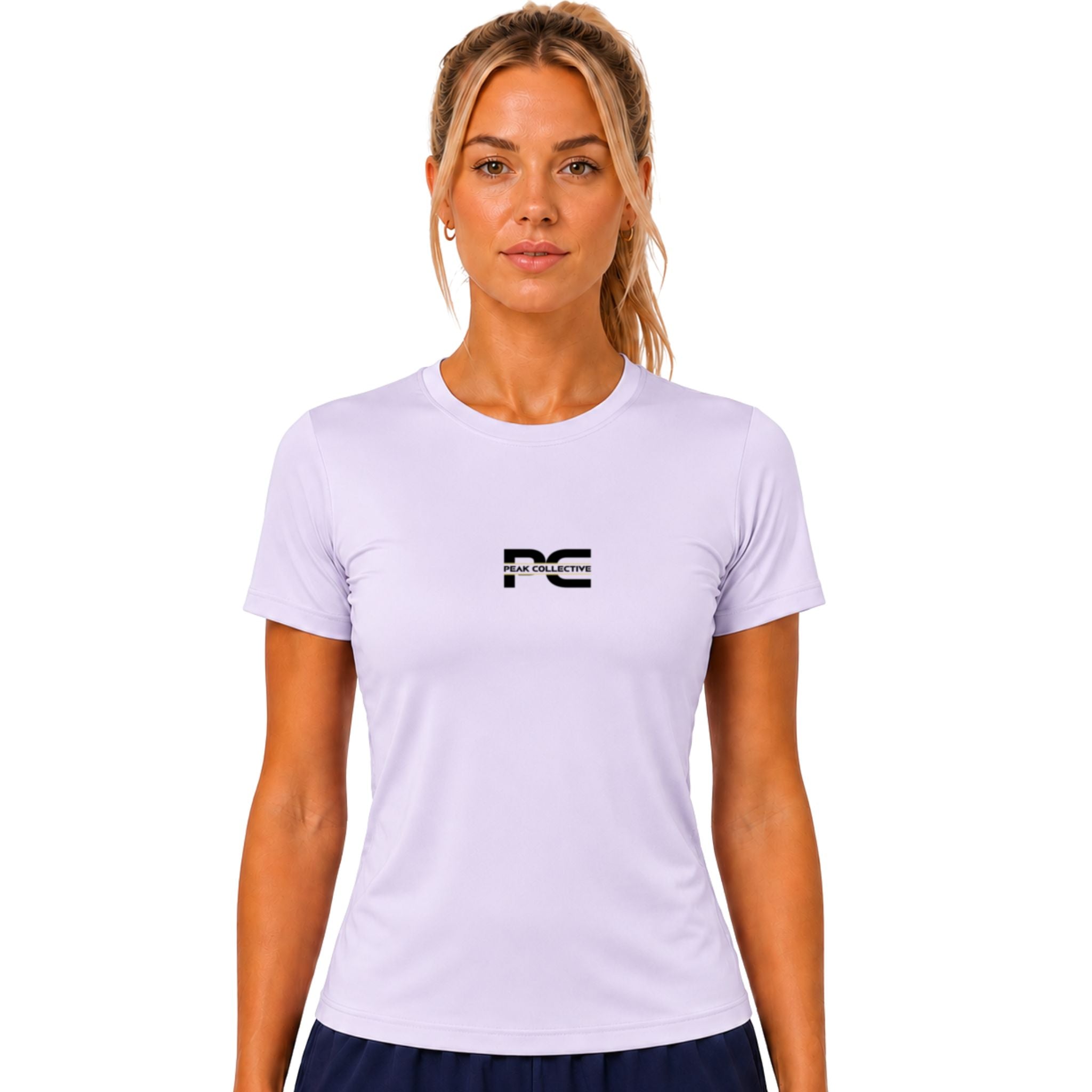 Woman wearing lilac AuraTee athletic performance shirt with logo on white background – lightweight women’s running top for gym workouts, training, jogging, and everyday activewear