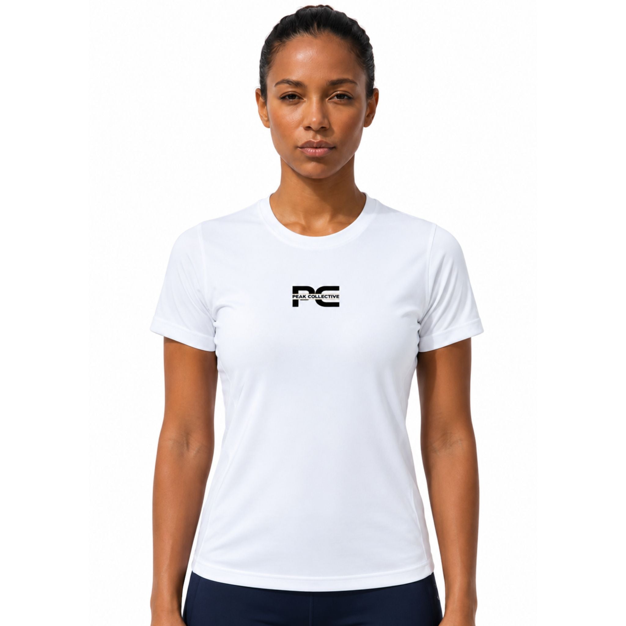 Woman wearing white AuraTee athletic performance shirt with logo on white background – lightweight women’s running top for gym workouts, training, jogging, and everyday activewear