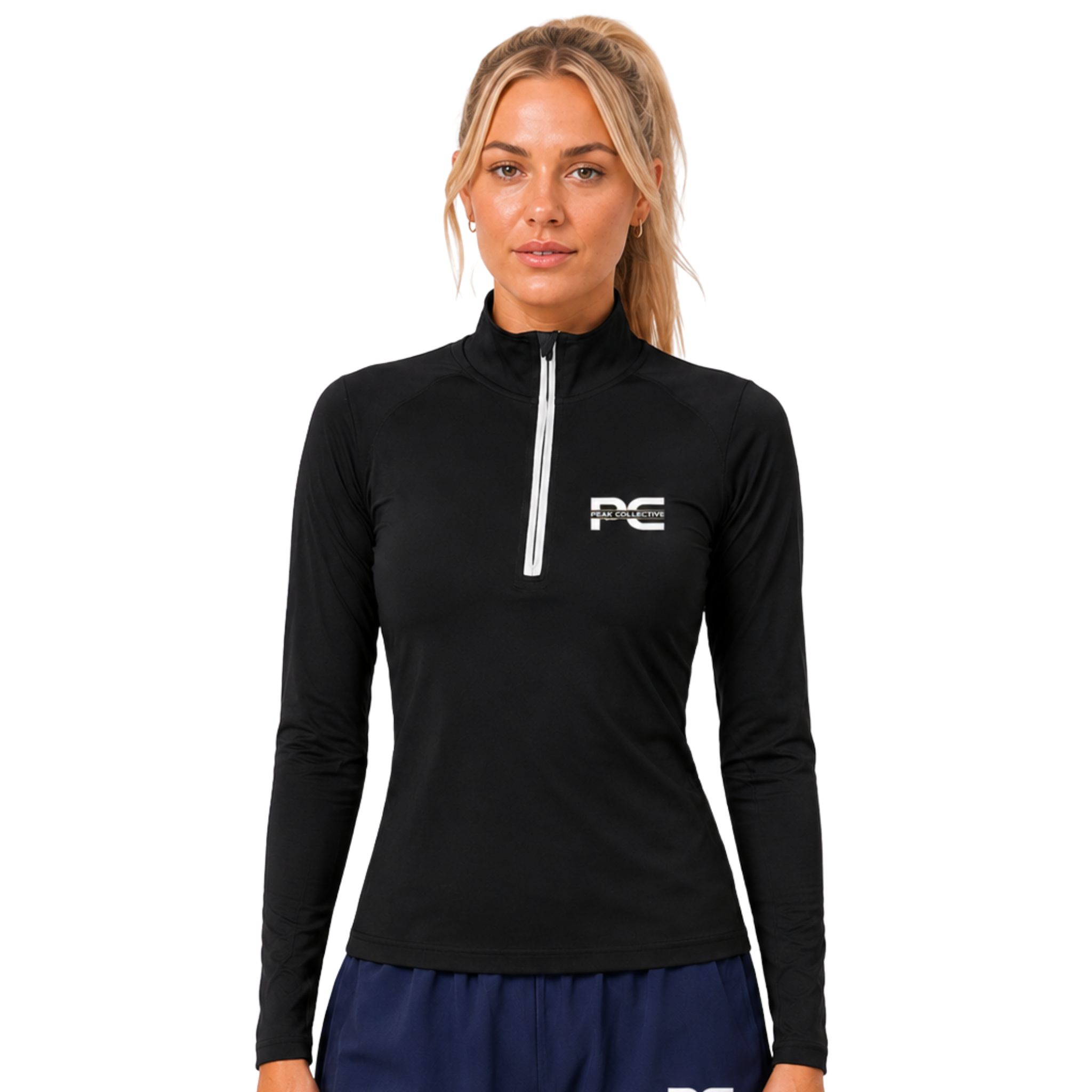 Woman wearing black/white AuraZip 1/4 long-sleeve performance top – lightweight women’s running layer for training, gym workouts, jogging, and activewear performance