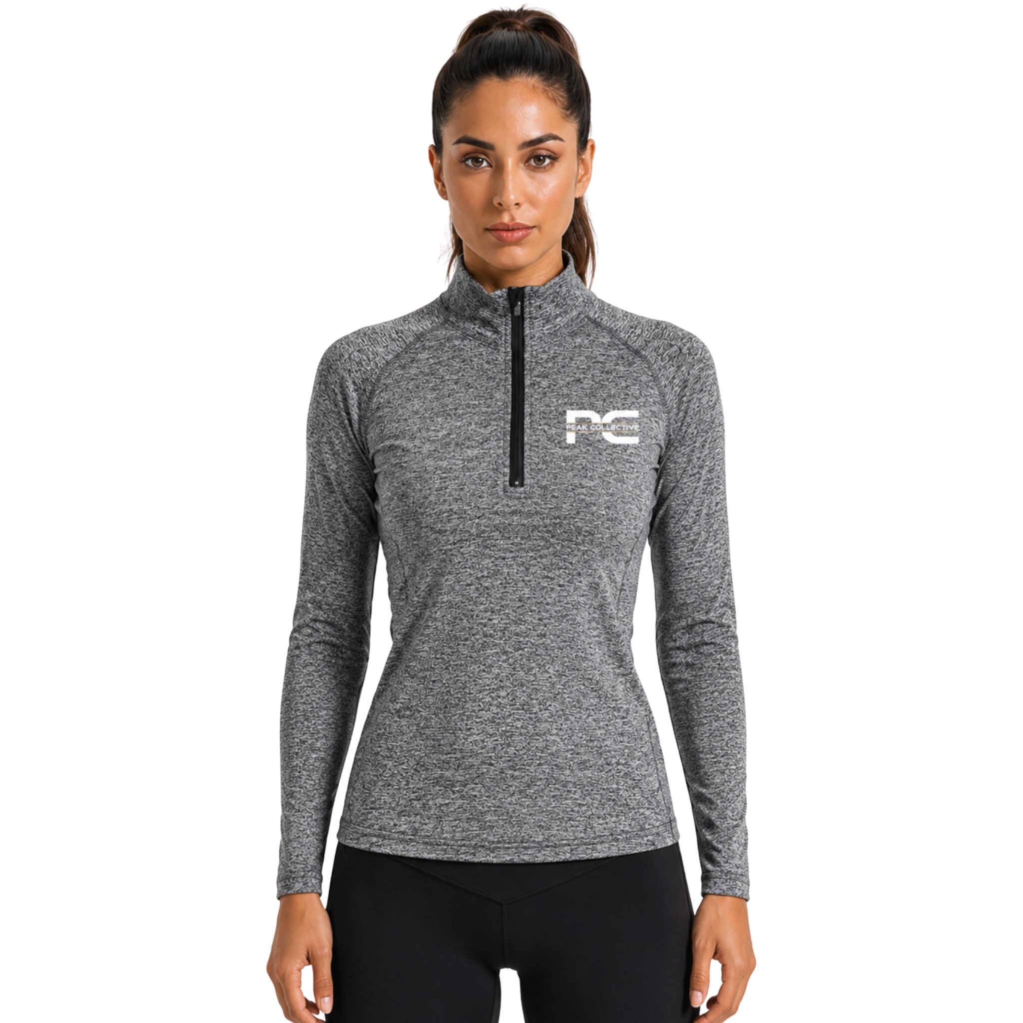 Woman wearing grey AuraZip 1/4 long-sleeve performance top – lightweight women’s running layer for training, gym workouts, jogging, and activewear performance