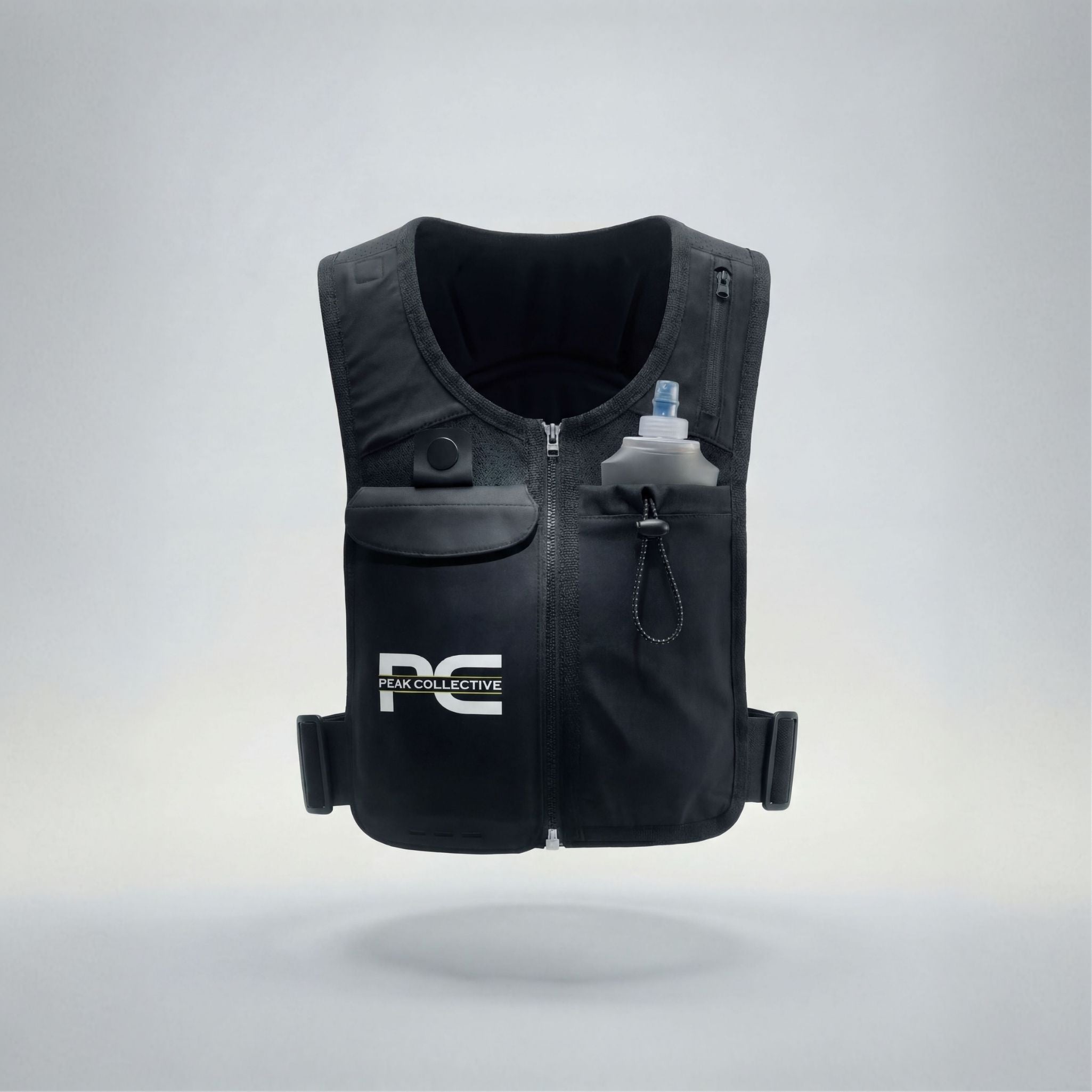 MagnaVest with PeakHydra soft flex bottle featuring Peak Collective logo, front view on light grey background, perfect for running, gym workouts, and active lifestyle hydration