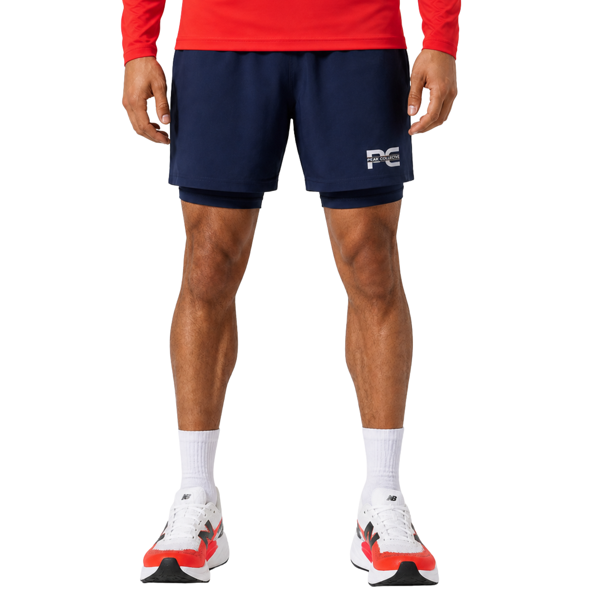 Man wearing navy CoreStrides double-layer athletic shorts with built-in undershorts and logo on white background – lightweight men’s running shorts for gym workouts, training, jogging, and everyday activewear performance