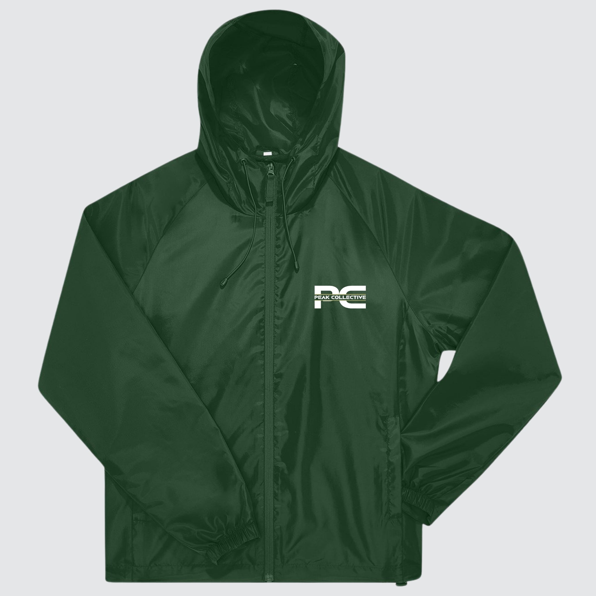 Green unisex AerisShell lightweight windbreaker with logo, lightweight performance jacket shown on a light grey background, ideal for running, workouts, and active movement.