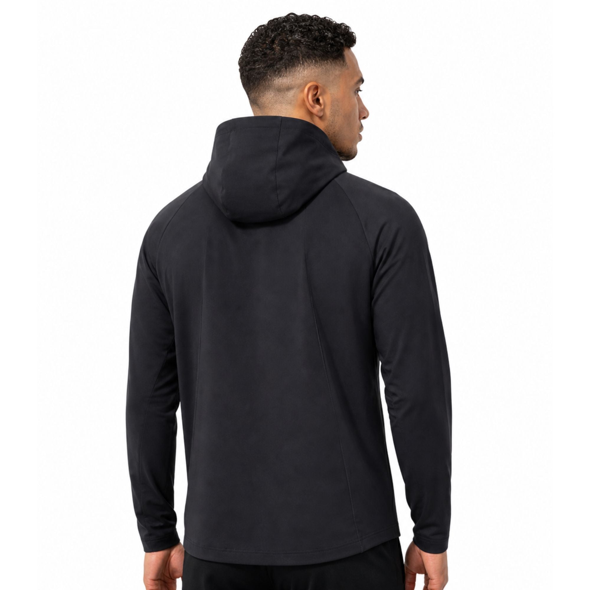 Male model wearing black unisex performance zip running jacket on plain white studio background