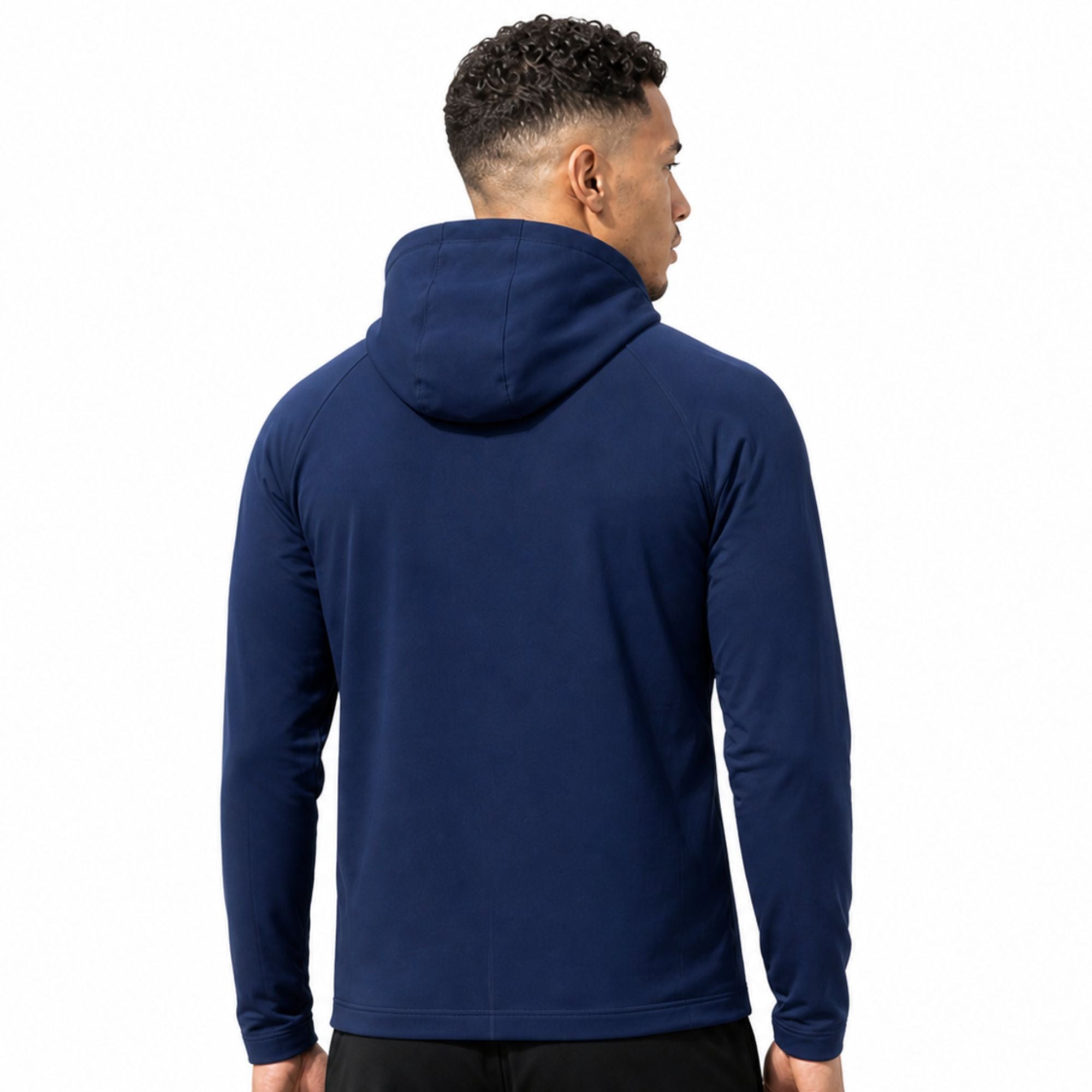 Male model wearing navy blue unisex performance zip running jacket on plain white studio background