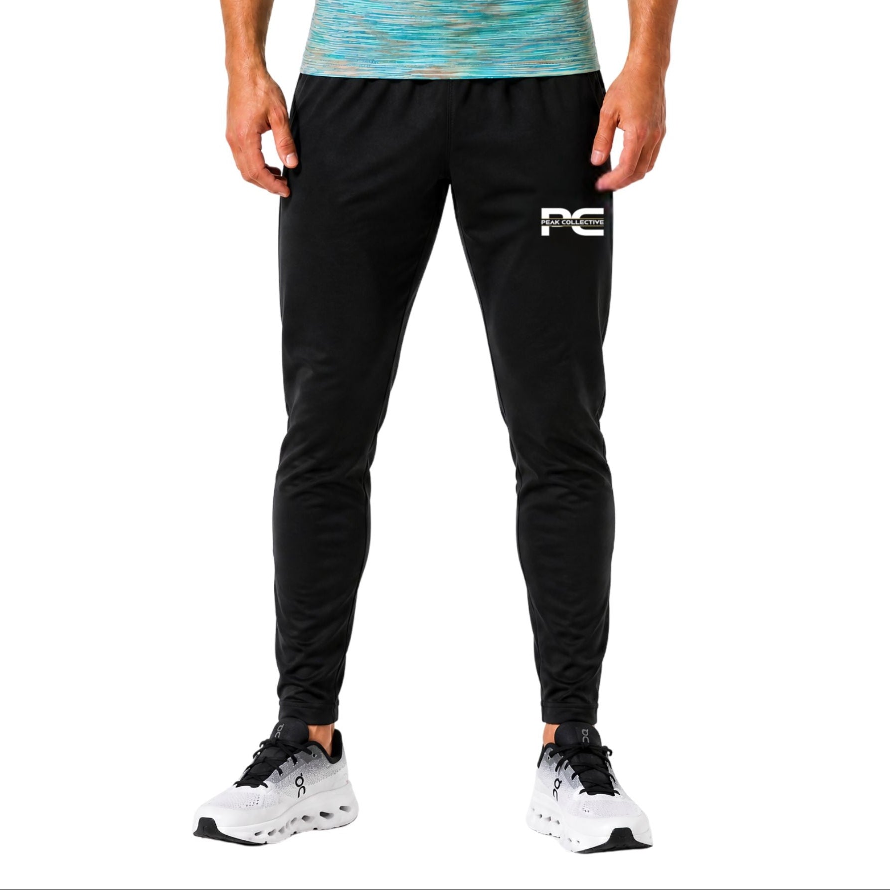 Man wearing black AeroJoggers with logo on white background – slim-fit men’s performance joggers for running, gym workouts, training sessions, and everyday activewear