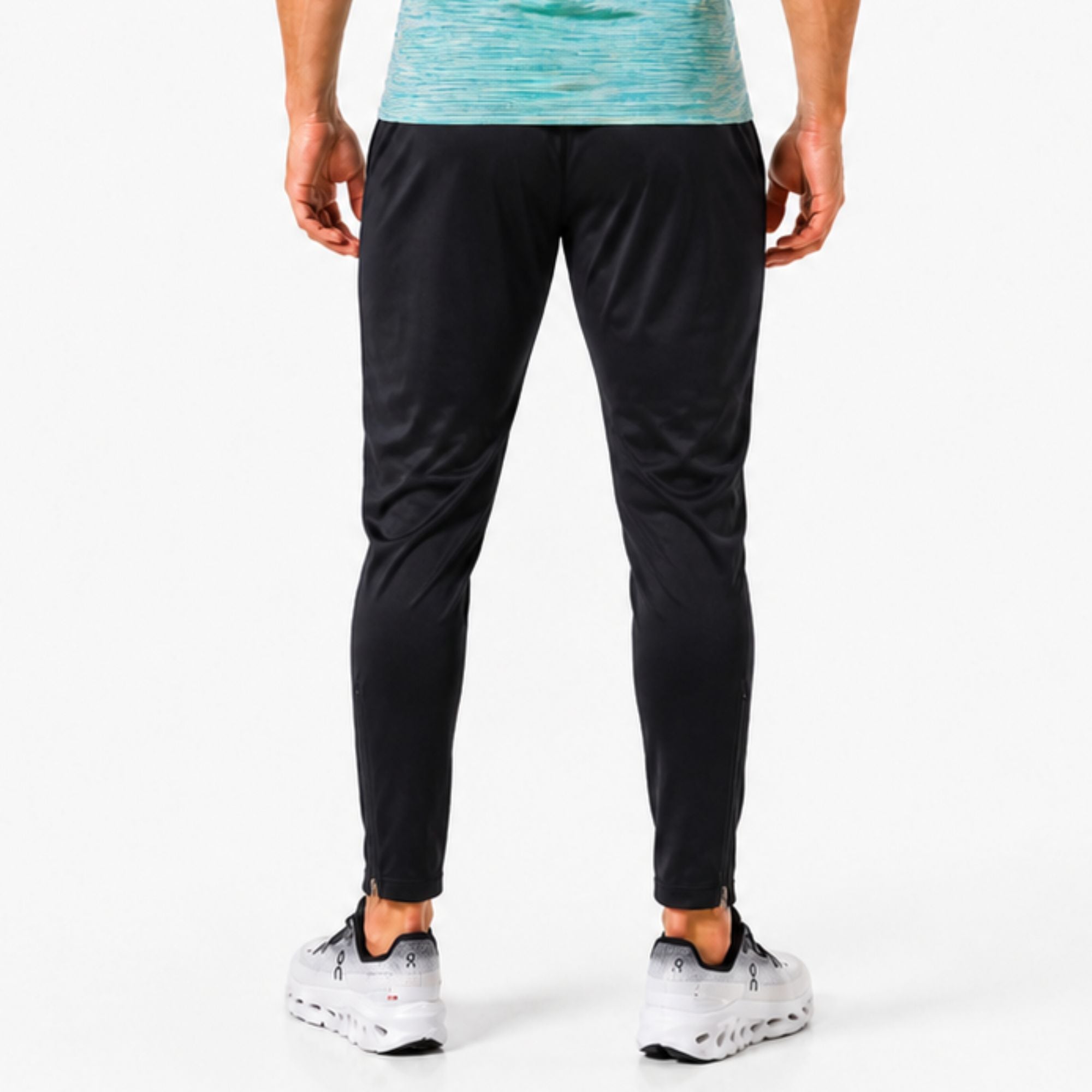  Back view of man wearing black AeroJoggers on white background – slim-fit men’s performance joggers for running, gym workouts, training sessions, and everyday activewear
