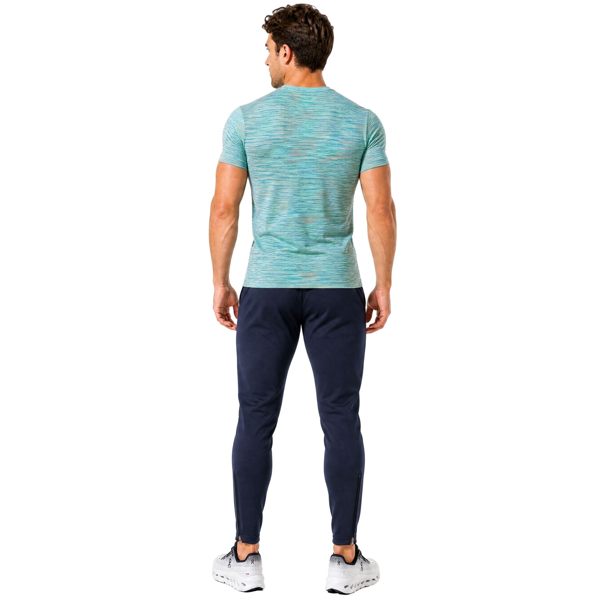 Man wearing light blue AeroSpace performance t-shirt and navy AeroJoggers on white background – breathable men’s activewear set for running, gym workouts, training sessions, and everyday fitness wear