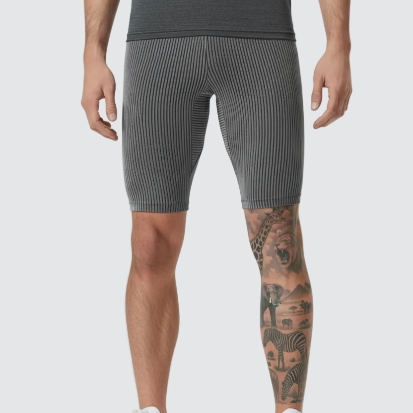 Person wearing AeroSkin Shorts, grey ribbed shorts for men designed for gym workouts, running, and active wear.
