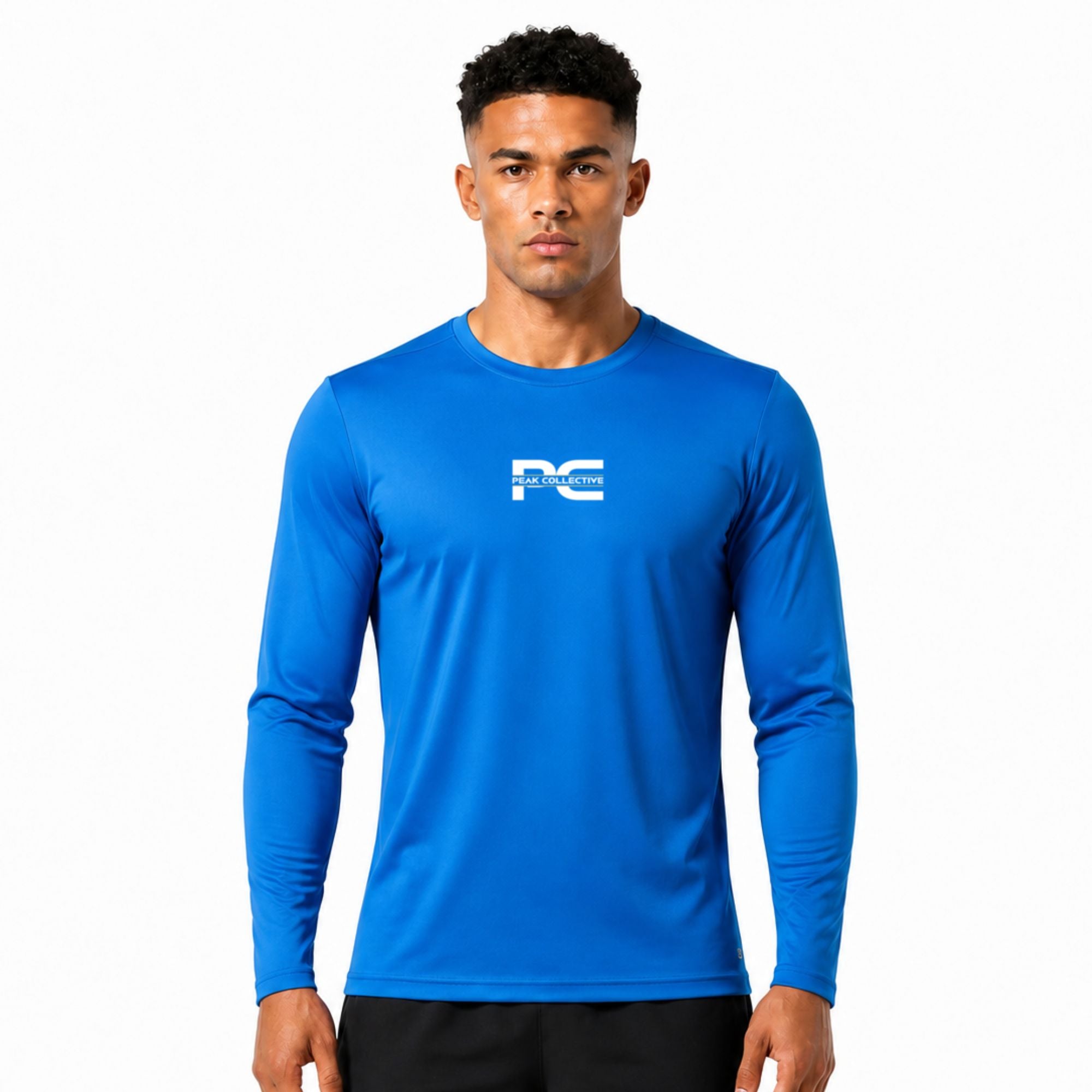 Male model wearing sapphire blue AeroSleeve long-sleeve performance shirt with logo on white background – lightweight men’s running top for training, gym workouts, jogging, and activewear performance