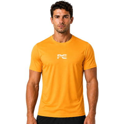 Male model wearing orange AeroTee Sapphire short-sleeve performance shirt with logo on white background – lightweight men’s running top for gym workouts, training, jogging, and activewear performance