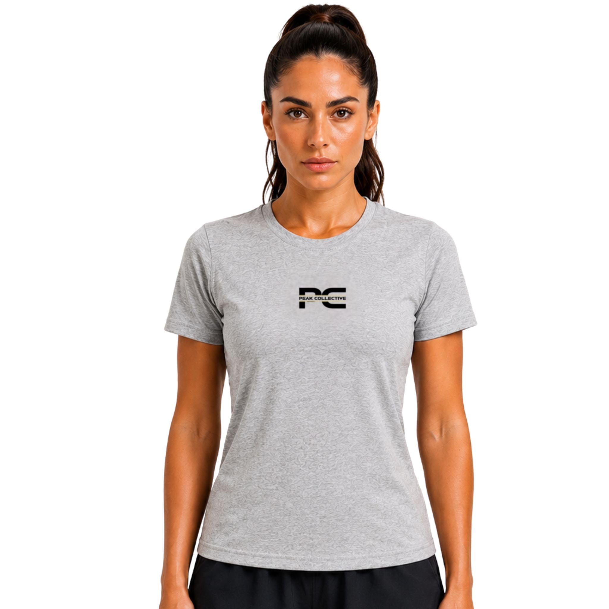 Woman wearing silver AuraTee athletic performance shirt with logo on white background – lightweight women’s running top for gym workouts, training, jogging, and everyday activewear