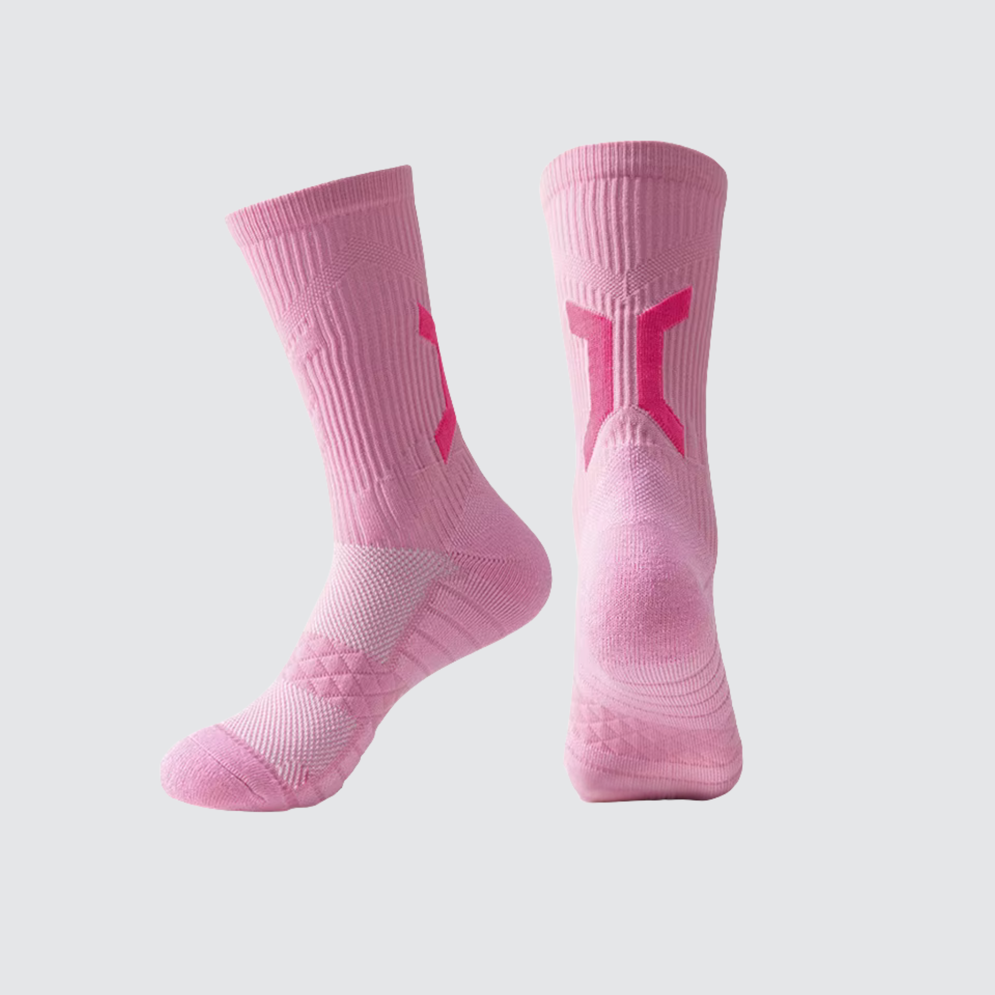 Pair of CoreSteppers athletic socks in Energy Pink displayed on a light grey background, designed for performance comfort and support.