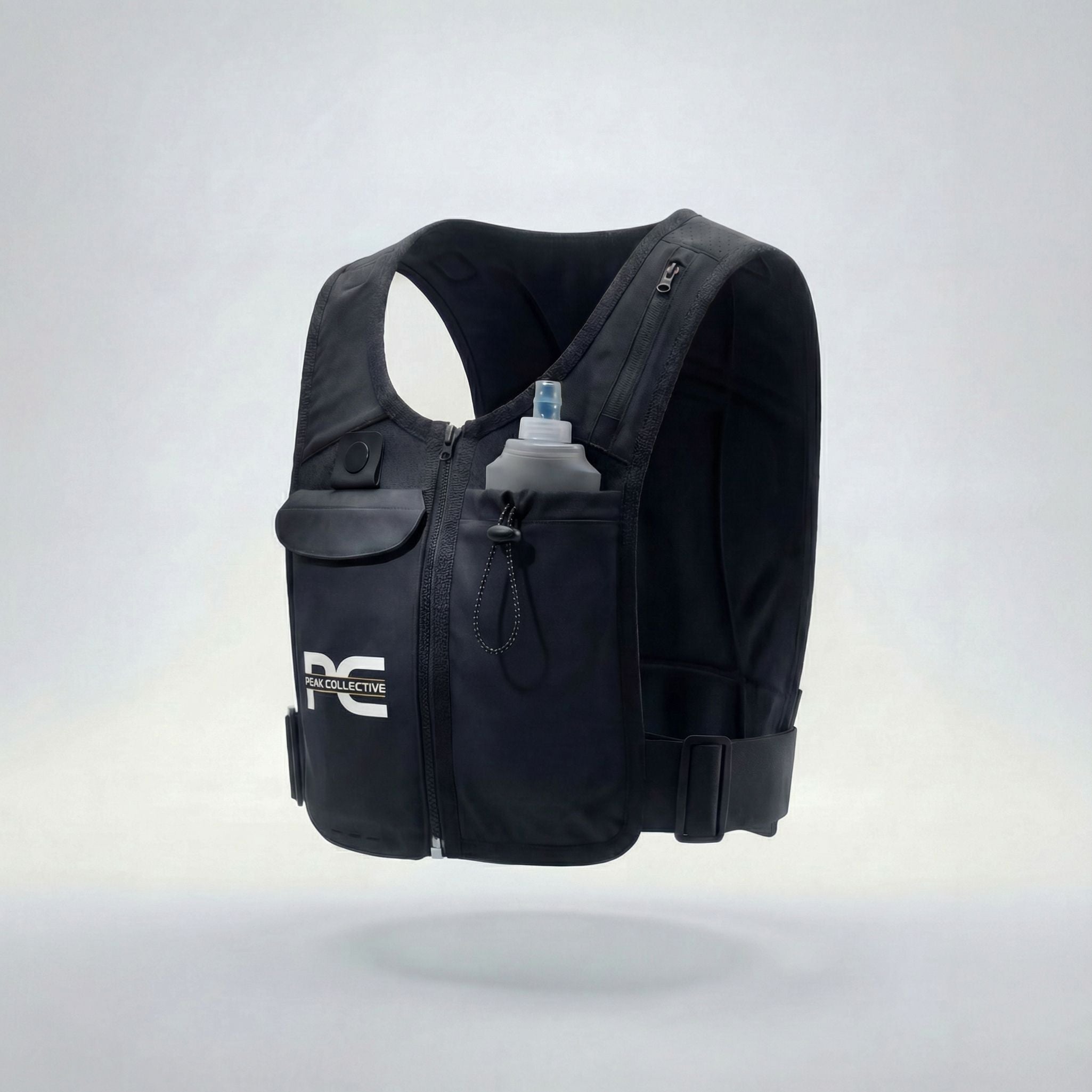 MagnaVest with PeakHydra soft flex bottle featuring Peak Collective logo, side view on light grey background, perfect for running, gym workouts, and active lifestyle hydration