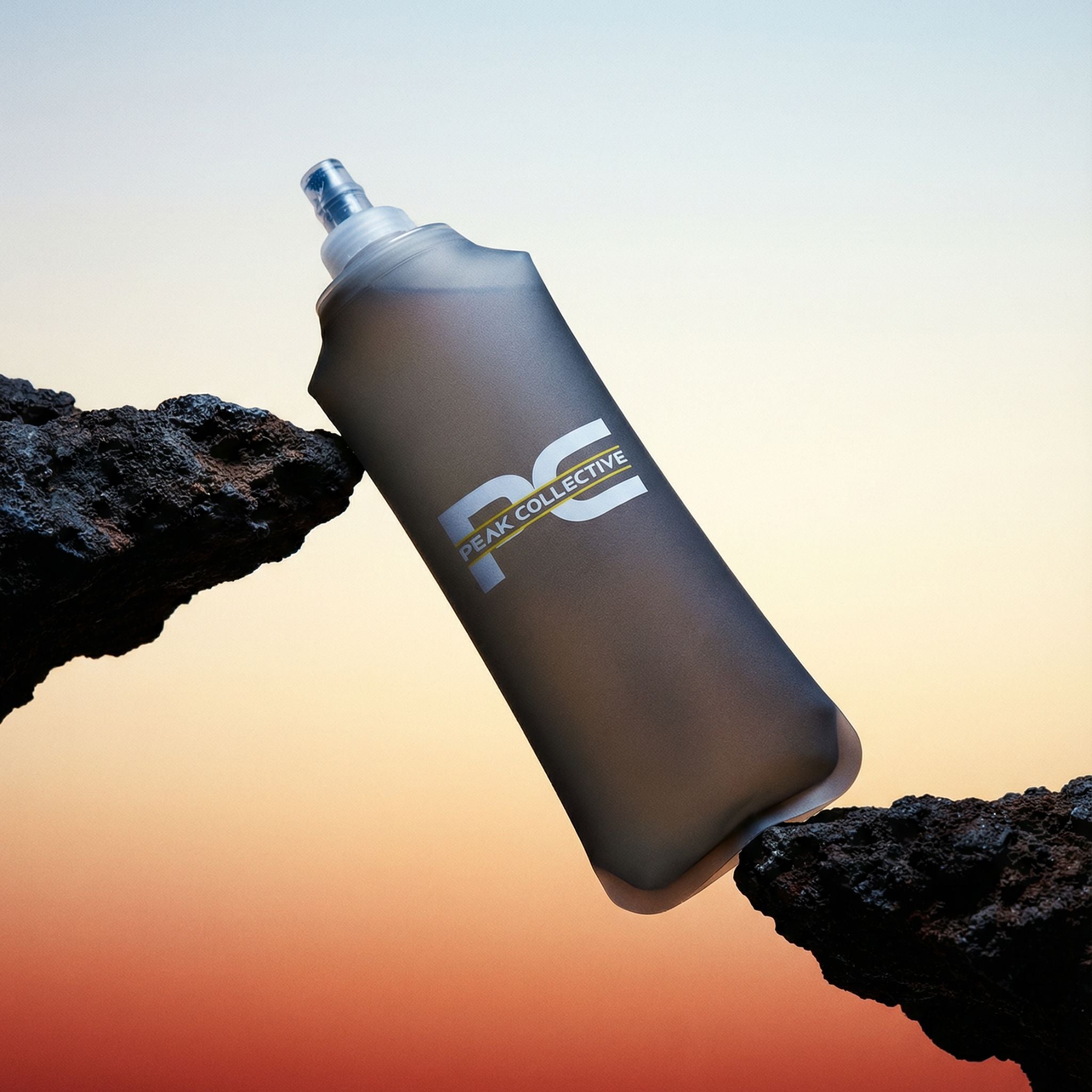 PeakHydra Soft Flex running bottle for hydration in running, gym and outdoor activities rested between two rocks