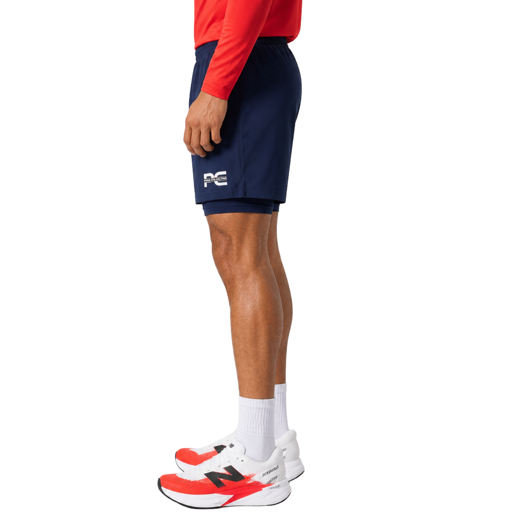 Man wearing navy CoreStrides double-layer athletic shorts with built-in undershorts and logo on white background – lightweight men’s running shorts for gym workouts, training, jogging, and everyday activewear performance